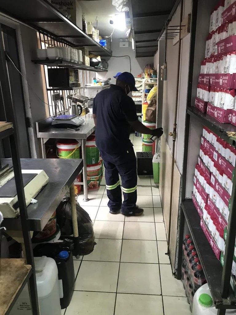 Technician treating a food storage facility